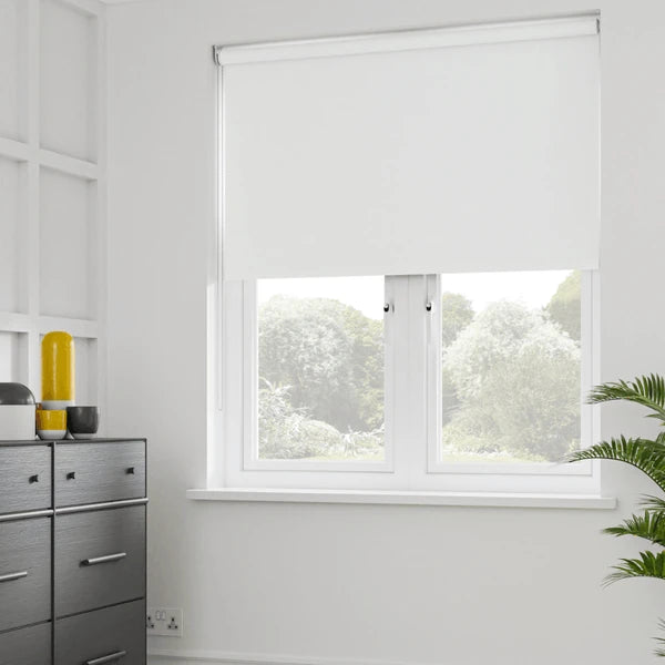 Custom white blockout roller blind in a Sydney bedroom